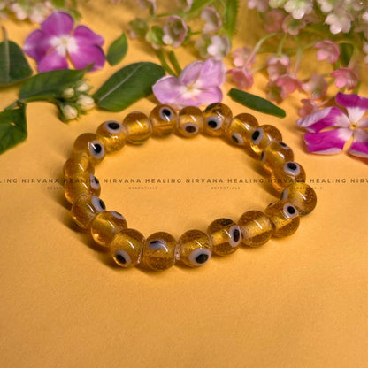 YELLOW CRYSTAL EVIL EYE ROUND BEADED BRACELET (Optimism, Clarity, Protection) image 0