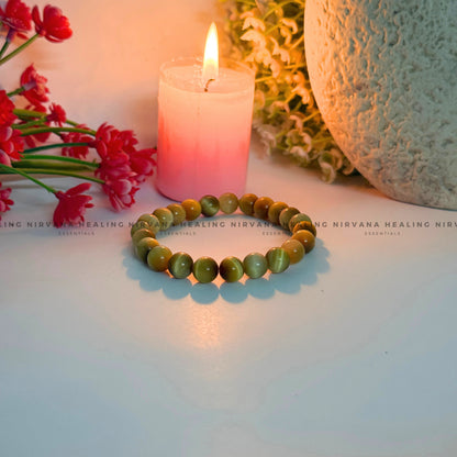 YELLOW CATS EYE ROUND BEADED BRACELET (Balance, Purity And Divine Protection) image 2