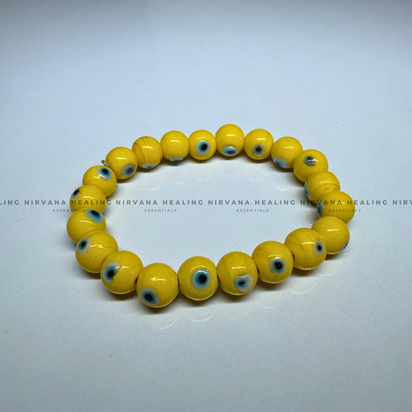 YELLOW EVIL EYE ROUND BEADED BRACELET (Optimism, Clarity, Protection) image 1