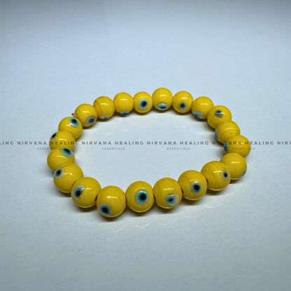 YELLOW EVIL EYE ROUND BEADED BRACELET (Optimism, Clarity, Protection) image 1