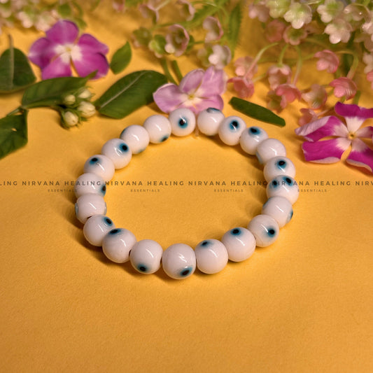 WHITE EVIL EYE ROUND BEADED BRACELET (Purity, Protection And New Beginnings) image 0