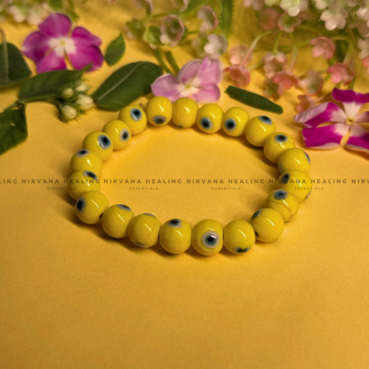 YELLOW EVIL EYE ROUND BEADED BRACELET (Optimism, Clarity, Protection) image 0